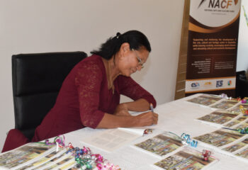 Dr Odile de Comarmond autographing copies of her book
