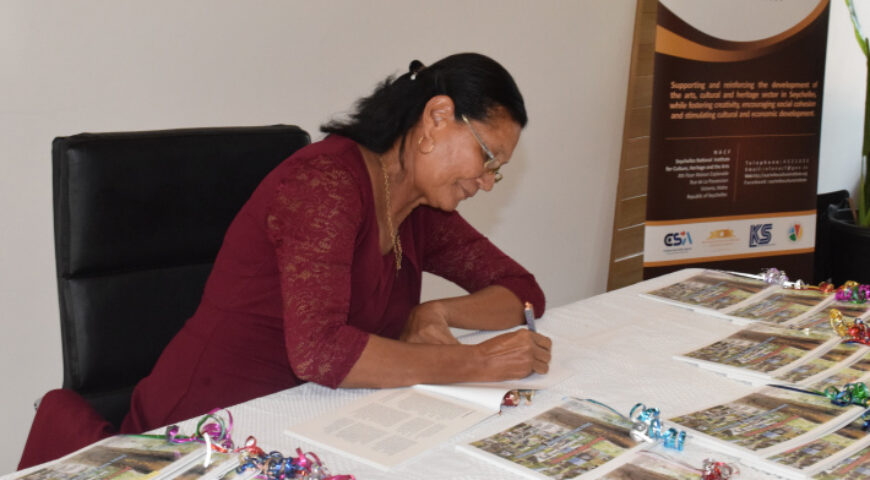 Dr Odile de Comarmond autographing copies of her book